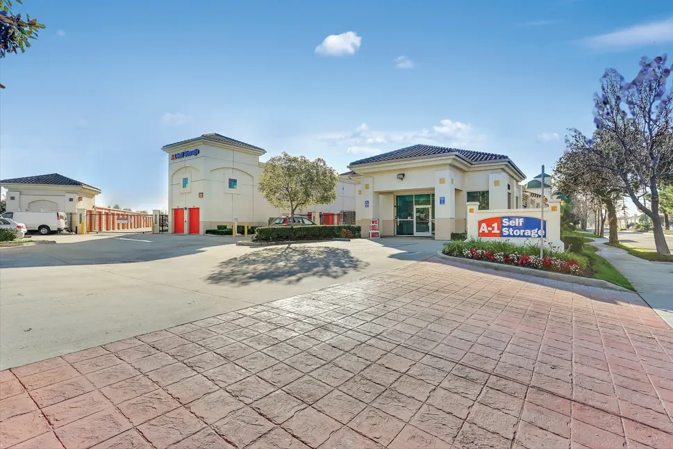 Front entrance with office door, handicap parking, and gate to drive-up units
