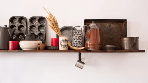 Various vintage containers and jars are neatly arranged